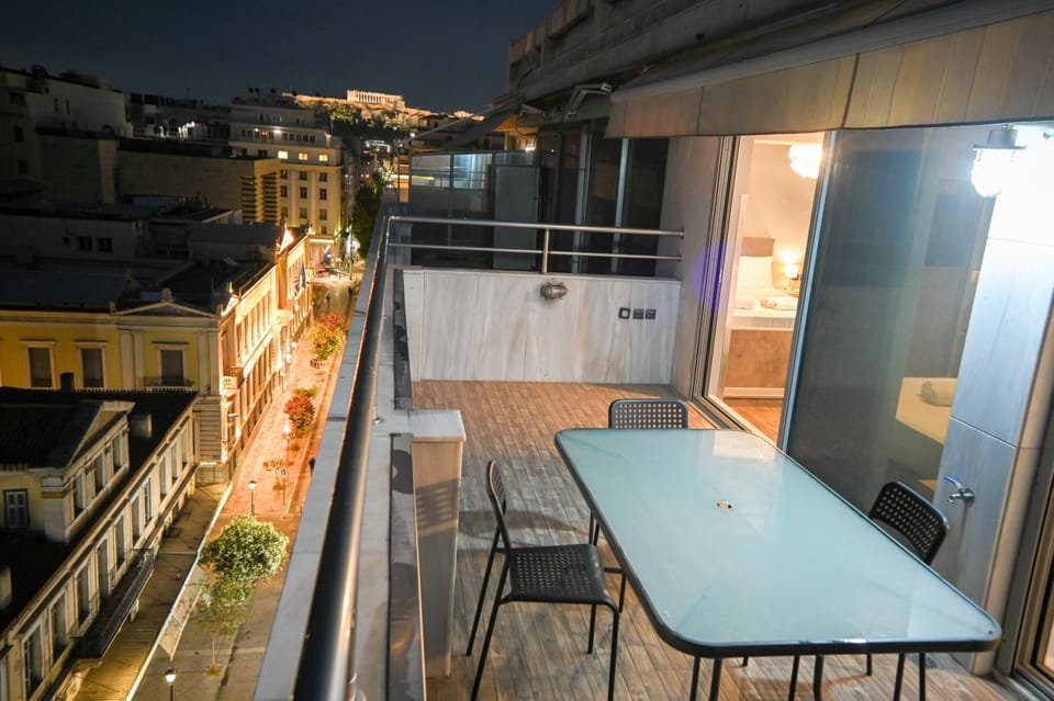Property building, Night, View (from property/room), Balcony/Terrace, Dining area, City view