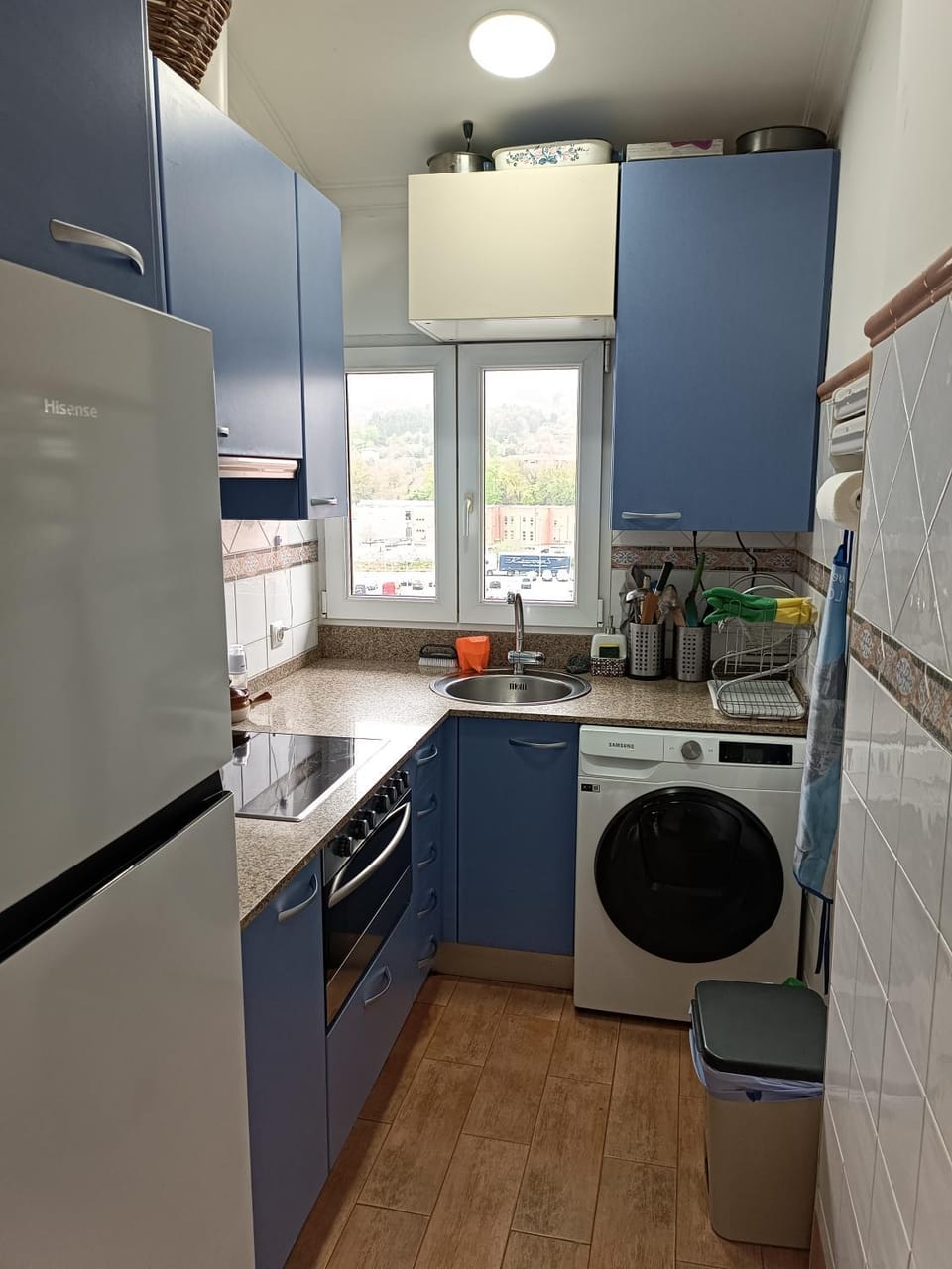 Kitchen or kitchenette, oven, stove, toaster, washing machine, dryer