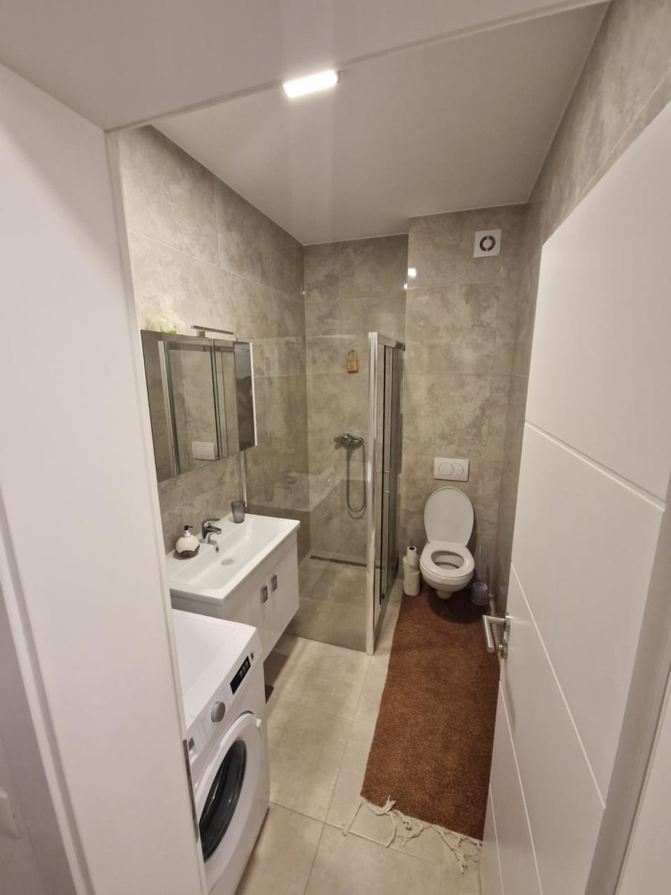 Shower, Toilet, Bathroom, towels, washing machine, dryer