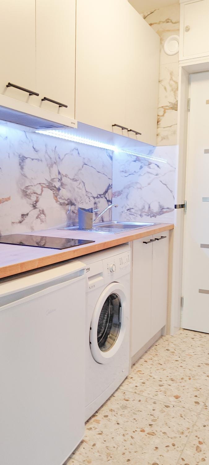 Kitchen or kitchenette, stove, washing machine