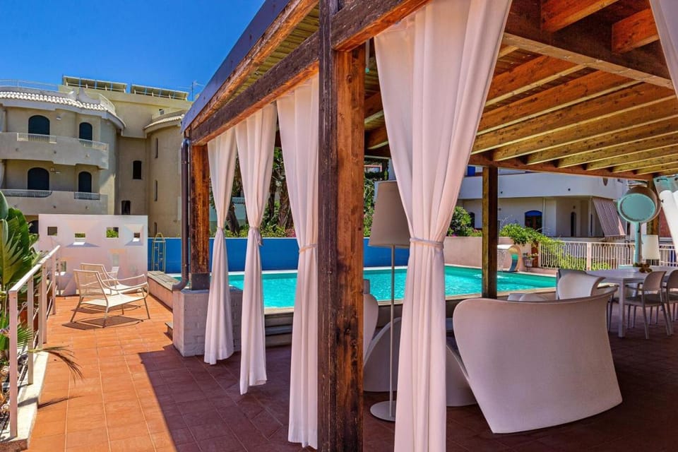 Property building, Patio, Day, View (from property/room), Balcony/Terrace, Pool view, Swimming pool