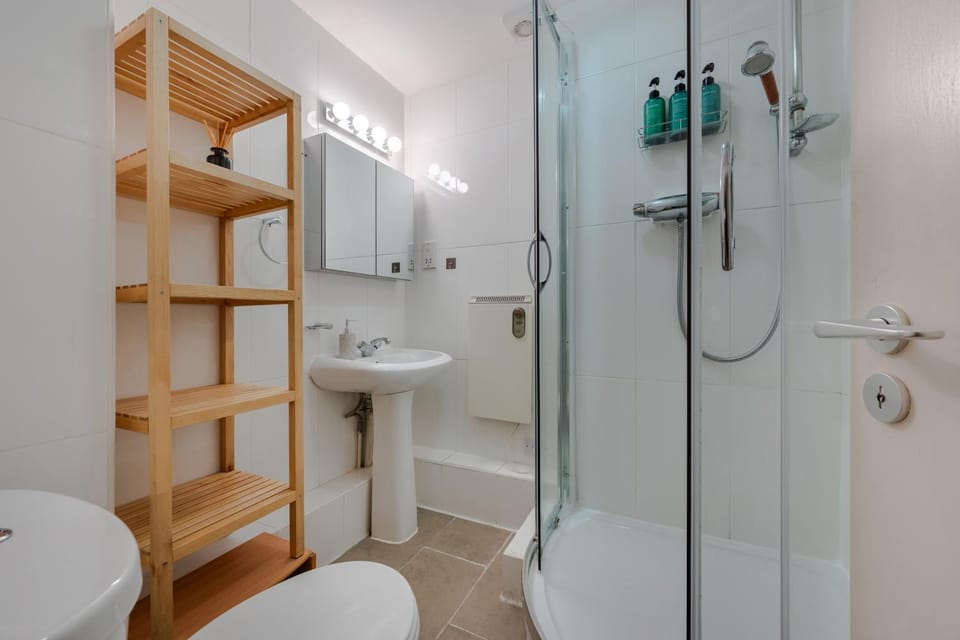 Shower, Toilet, Bathroom, hair dryier, towels