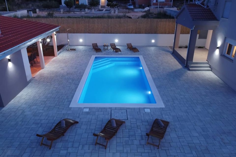 Property building, Patio, Night, Pool view, Swimming pool, sunbed