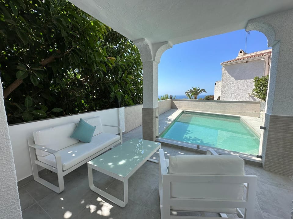Property building, Living room, Swimming pool