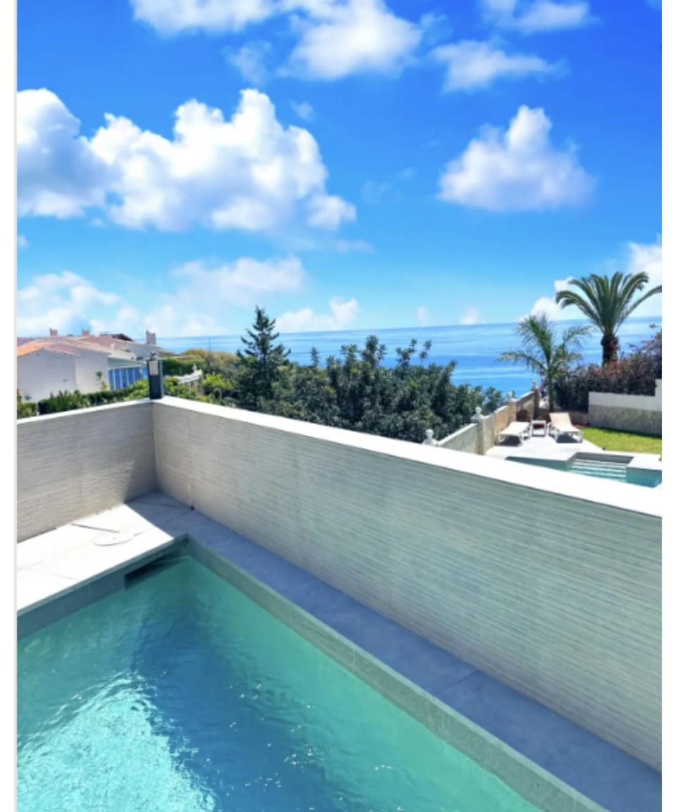 Property building, Living room, Swimming pool
