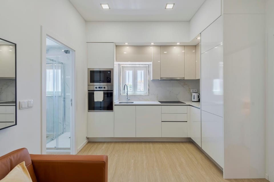 Kitchen or kitchenette, dishwasher, oven, stove