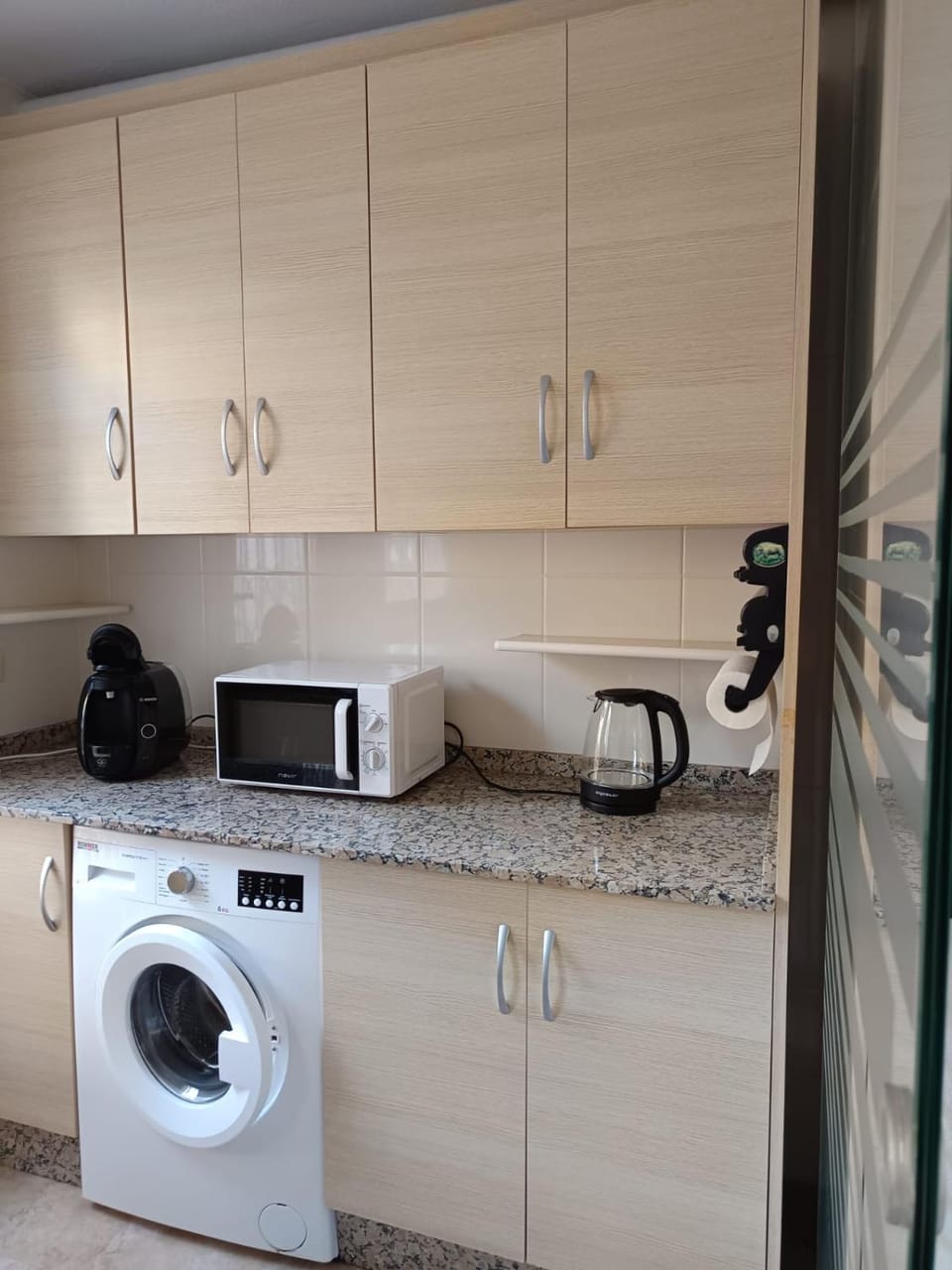 Kitchen or kitchenette, washing machine
