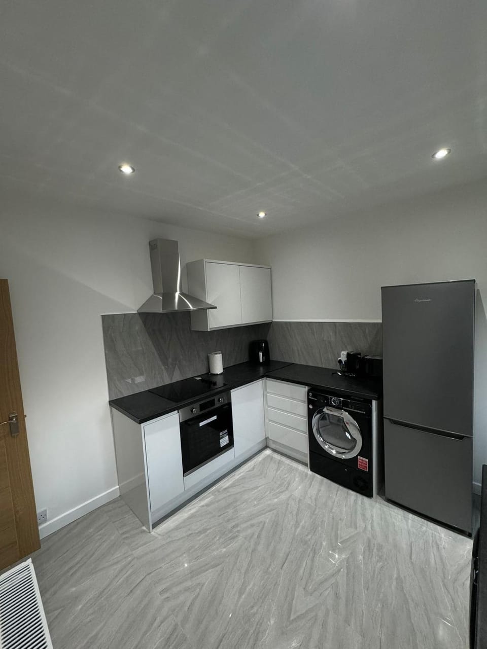 Kitchen or kitchenette, oven, stove, washing machine