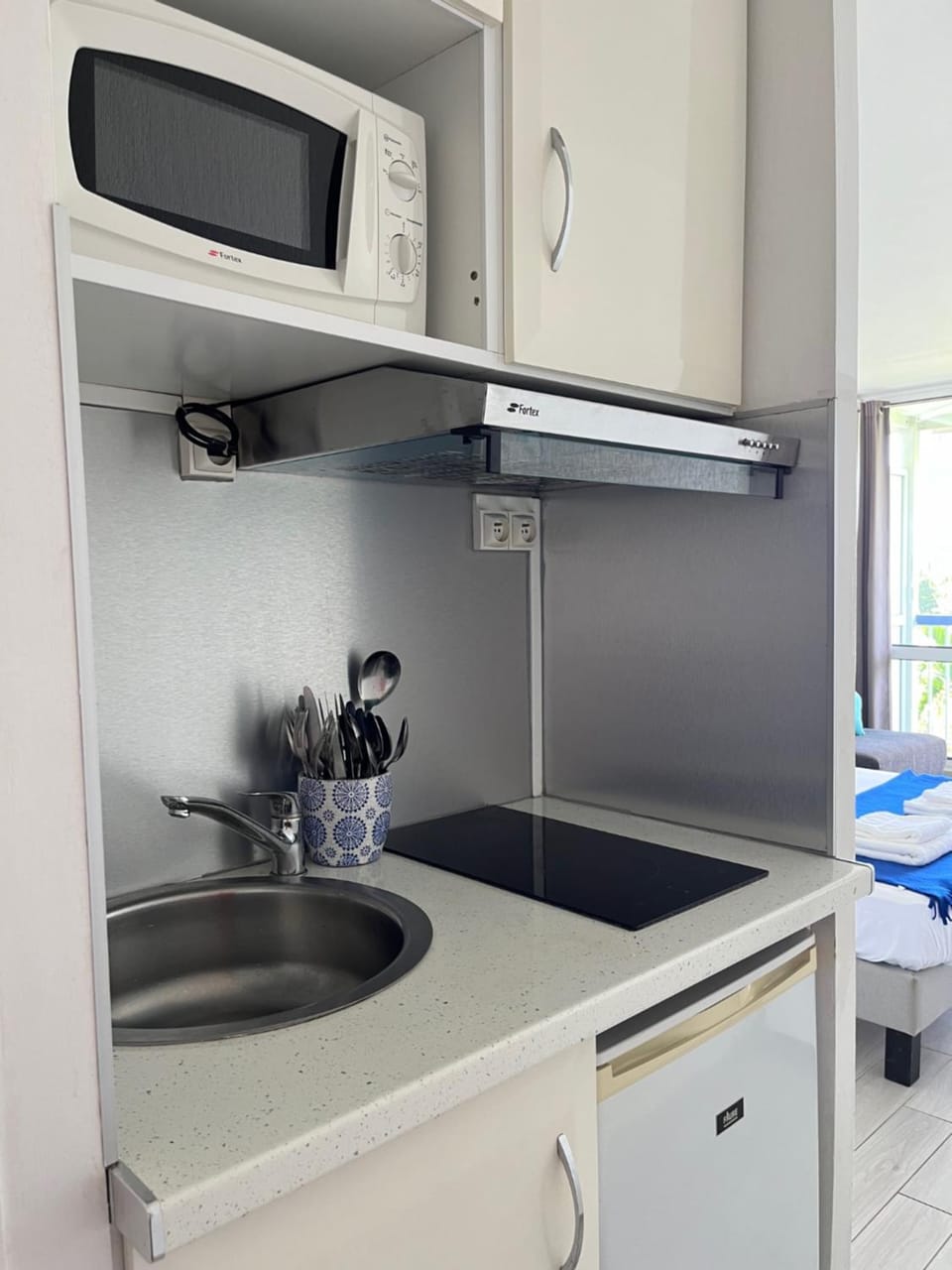 Kitchen or kitchenette, microwave