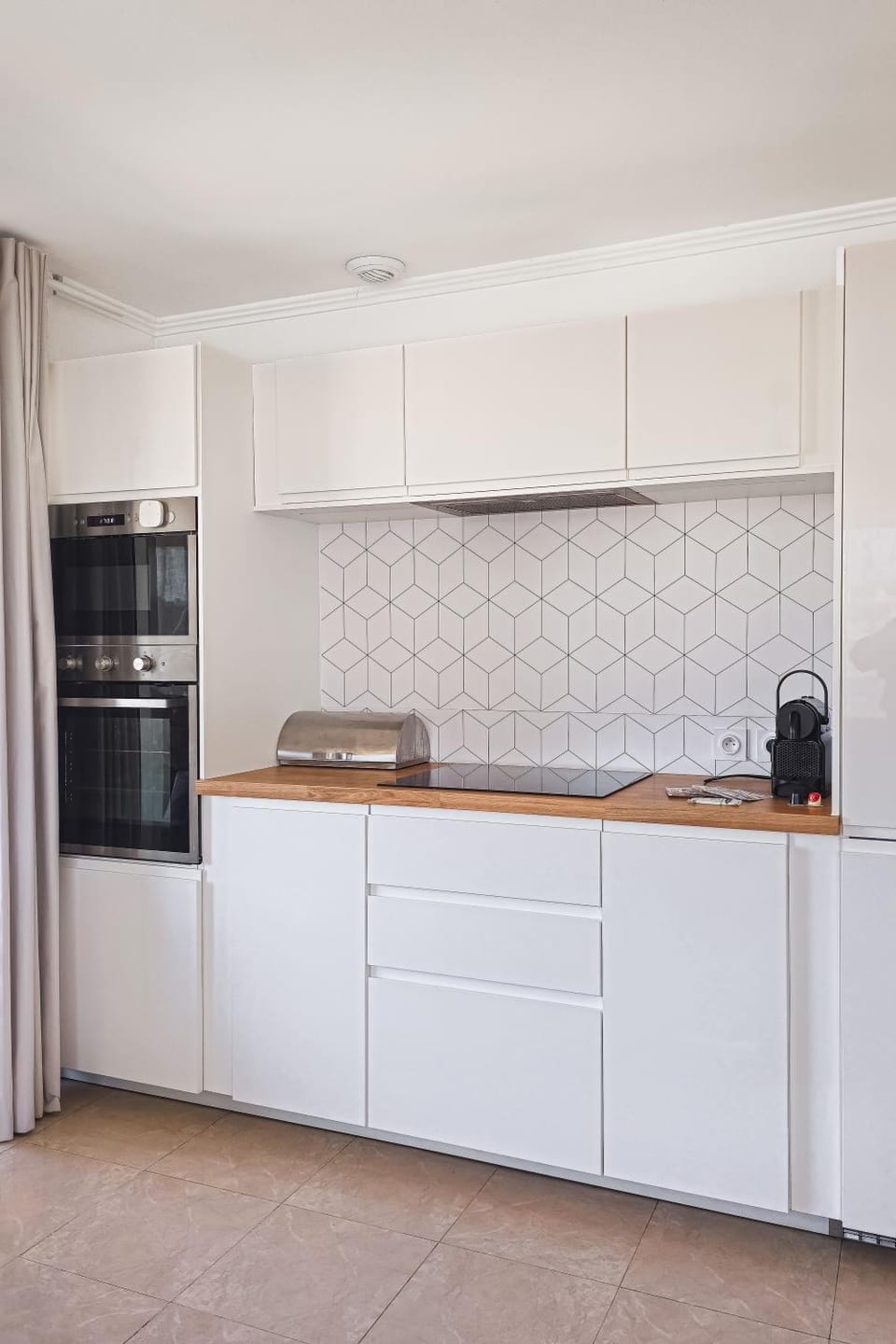 Kitchen or kitchenette, dishwasher, oven, stove