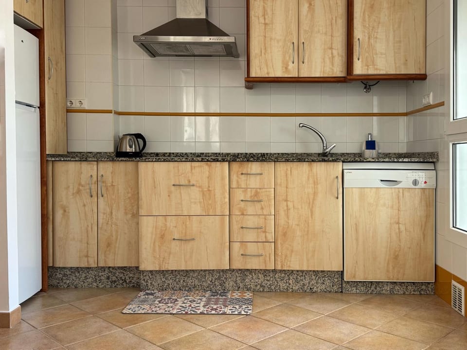 Kitchen or kitchenette, dishwasher, stove