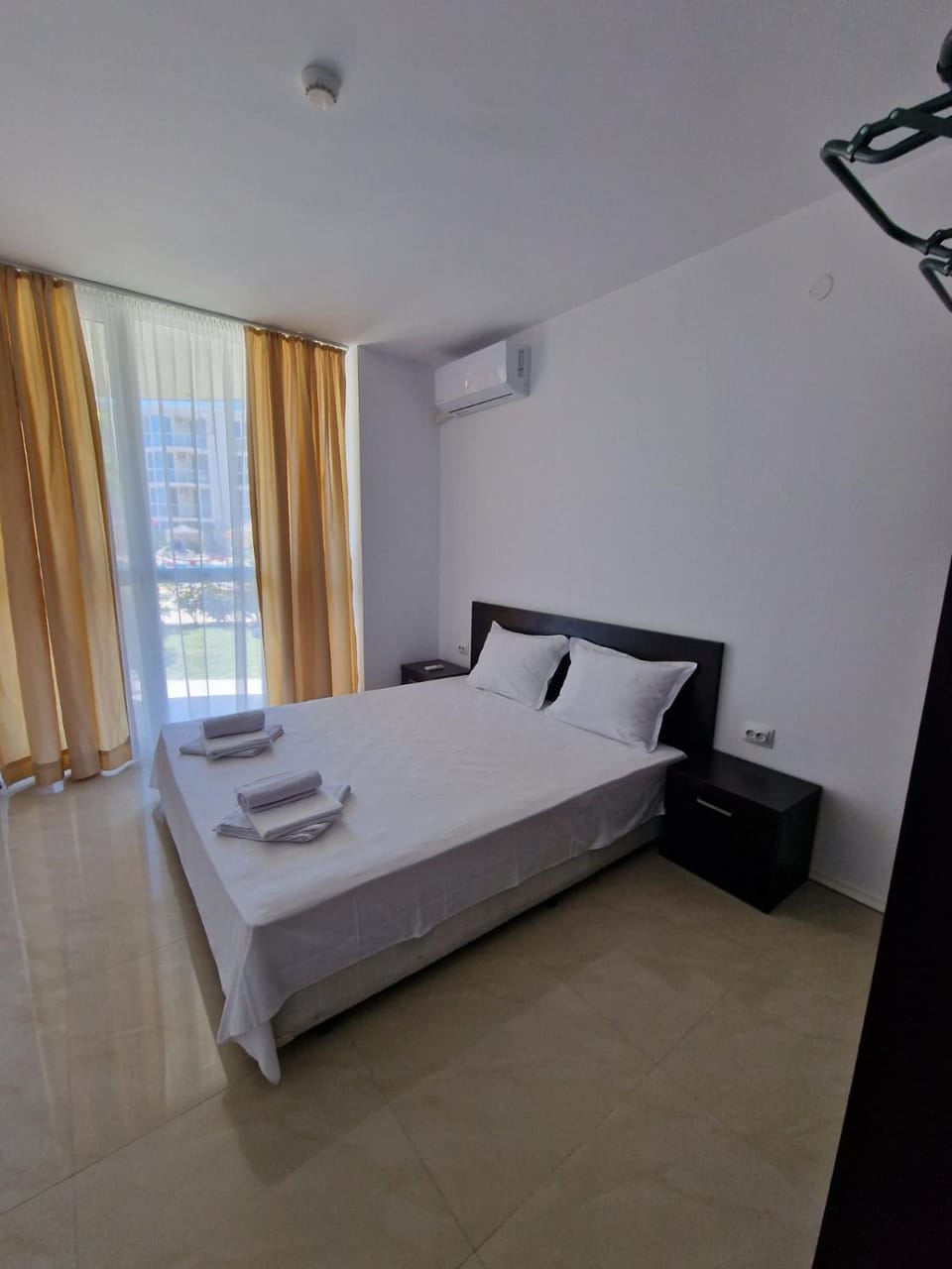 Photo of the whole room, Bedroom, towels, air conditioner