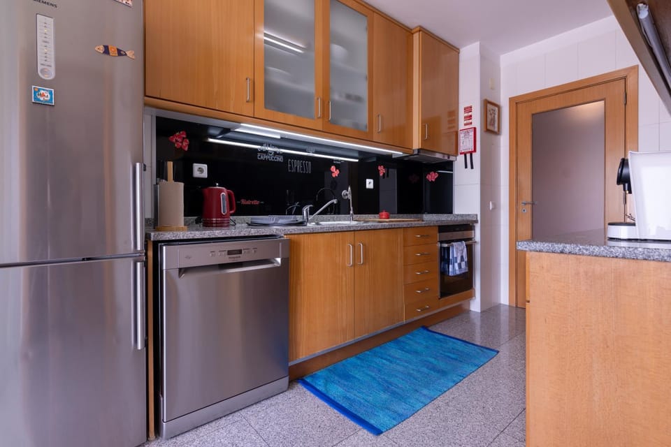 Kitchen or kitchenette, dishwasher, oven, stove