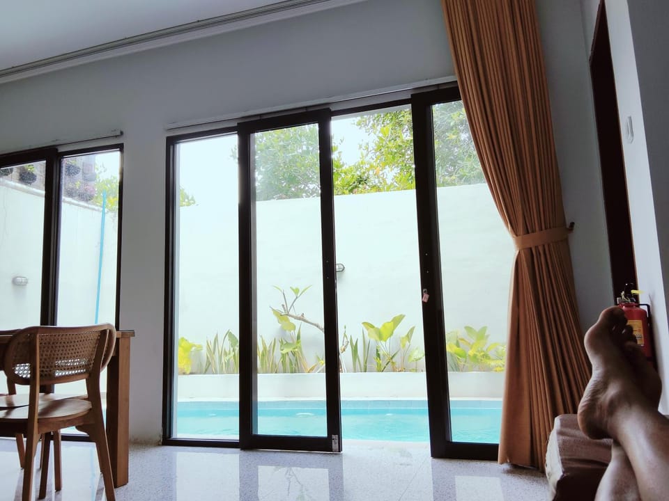 View (from property/room), Living room, Seating area, Pool view