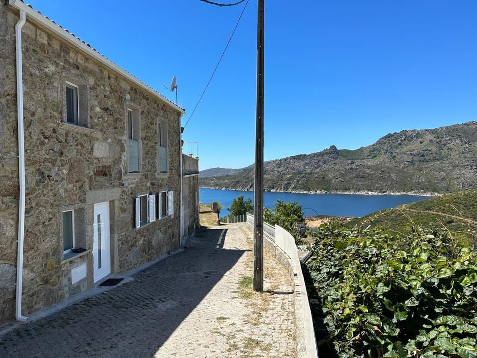 Property building, Facade/entrance, Natural landscape, Lake view, Mountain view
