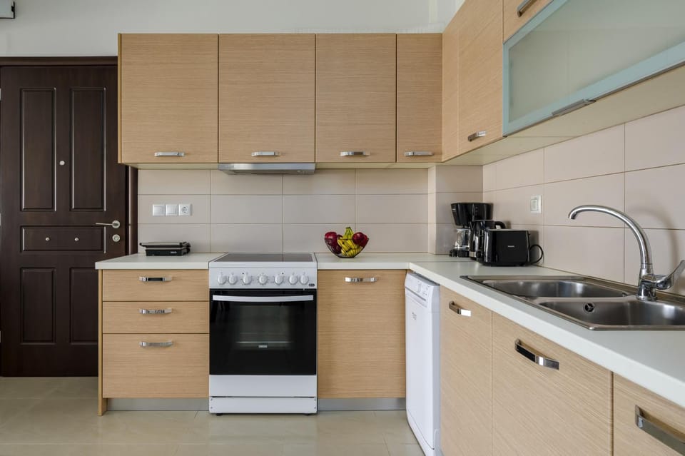 Kitchen or kitchenette, dishwasher, stove, toaster