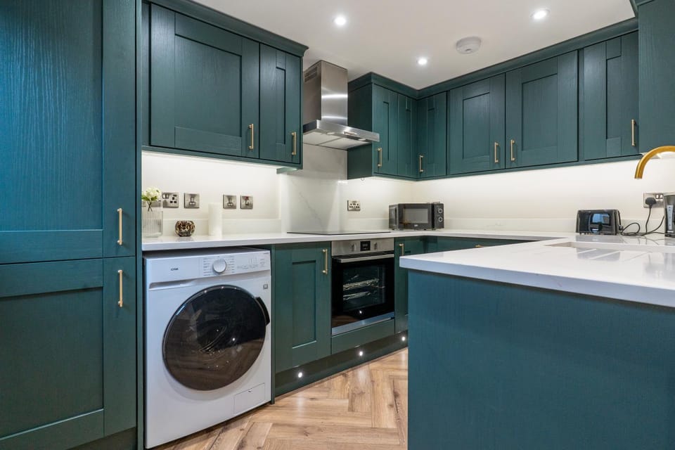 Kitchen or kitchenette, dishwasher, oven, stove, toaster, dryer