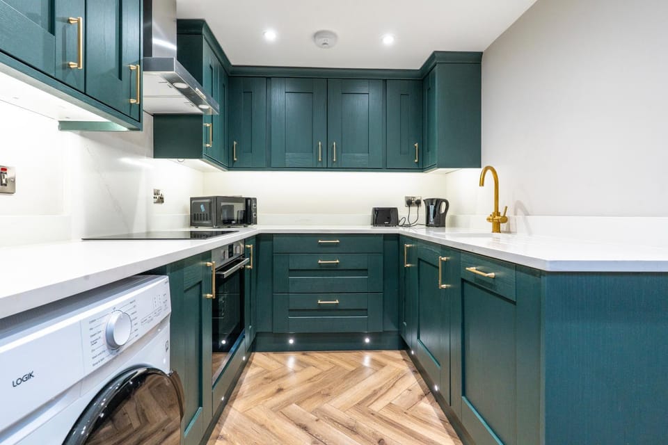 Kitchen or kitchenette, dishwasher, oven, stove, toaster