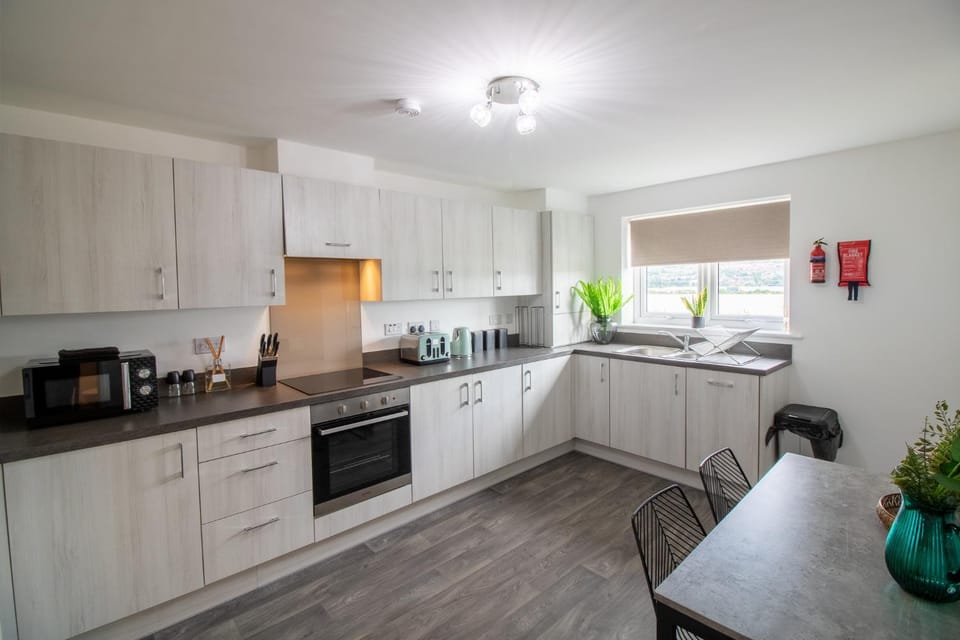Kitchen or kitchenette, microwave, oven, stove, toaster