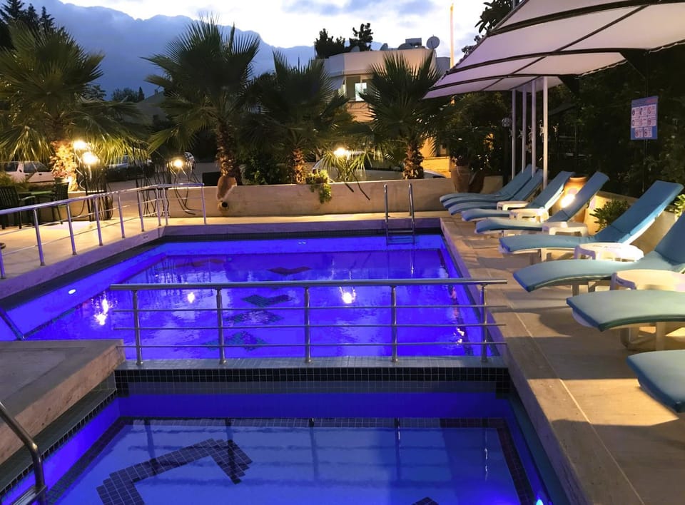 Patio, Night, Pool view, Swimming pool, sunbed