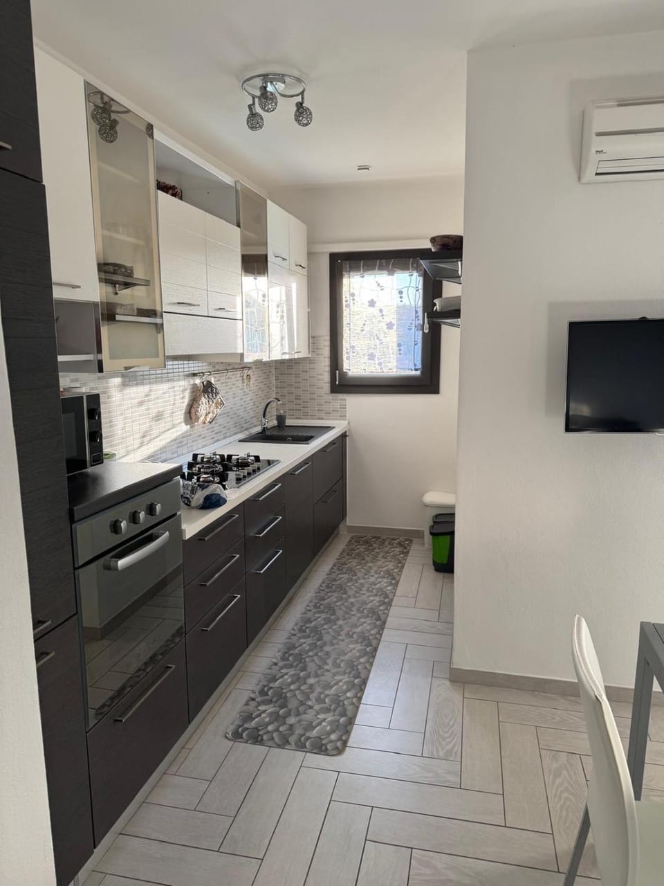 Kitchen or kitchenette, microwave, oven, stove, kitchen