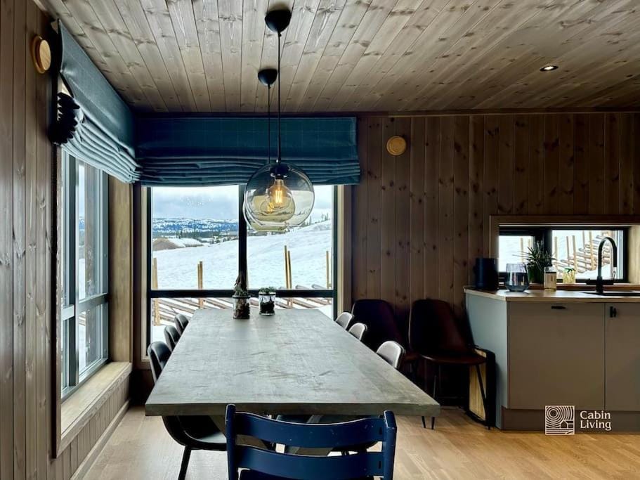 Idyllic cabin with great view right by the slopes Cabin in Innlandet