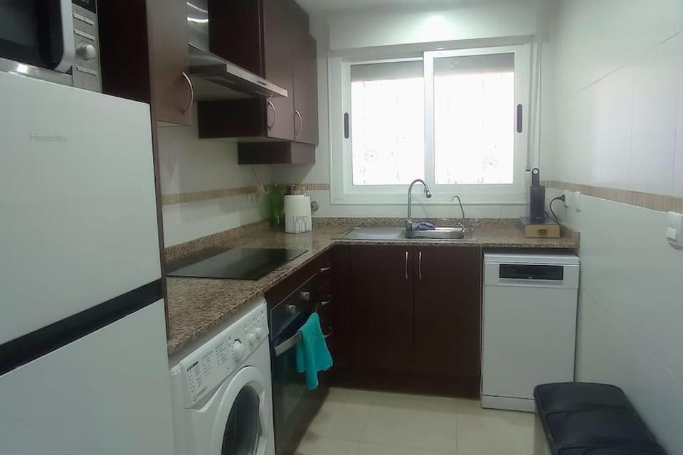 Kitchen or kitchenette, dishwasher, stove, washing machine