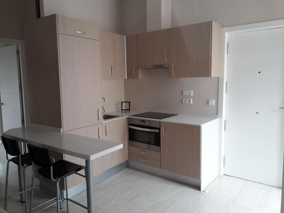 Kitchen or kitchenette, oven, stove