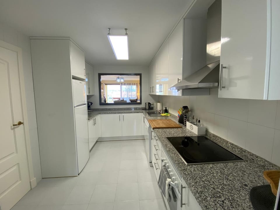 Kitchen or kitchenette, dishwasher, oven, stove
