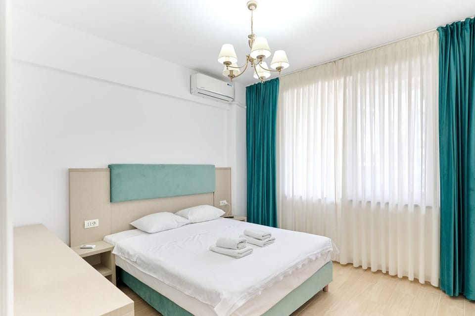 Bed, Photo of the whole room, Bedroom, towels, air conditioner
