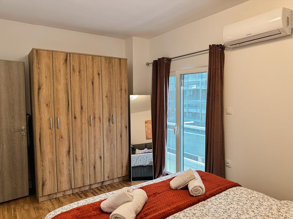 Photo of the whole room, Bedroom, towels, air conditioner