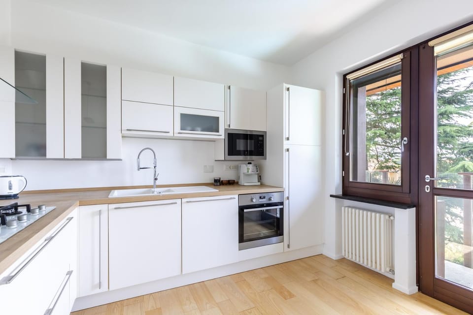 Kitchen or kitchenette, dishwasher, oven, stove