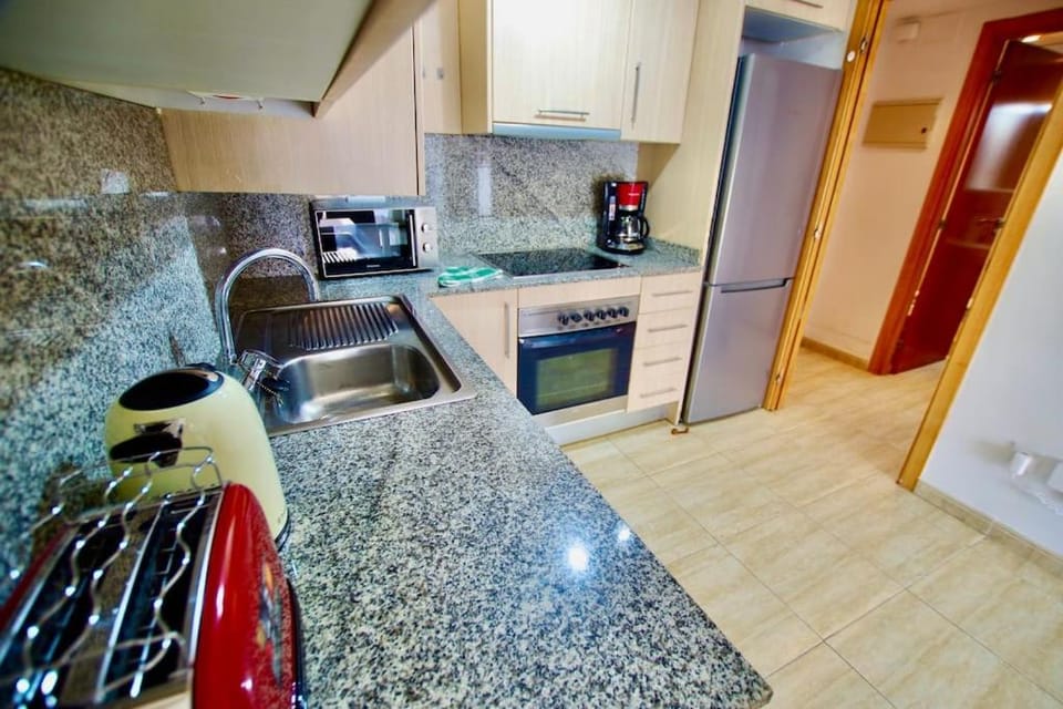 Kitchen or kitchenette, oven, toaster