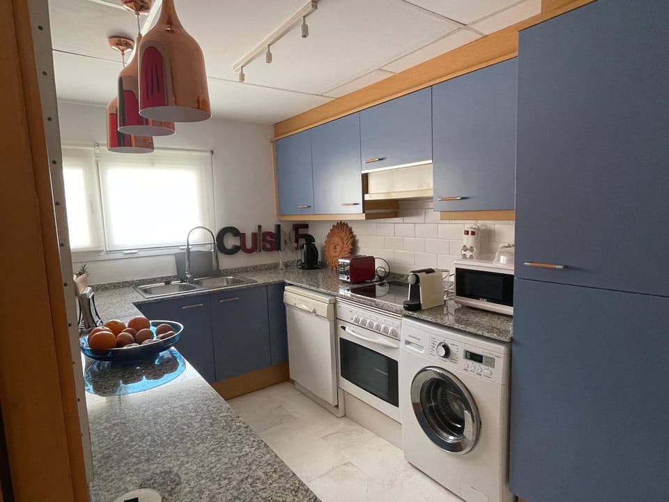 Kitchen or kitchenette, dishwasher, oven, stove, toaster, washing machine