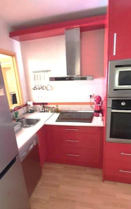 Kitchen or kitchenette, dishwasher, oven, stove