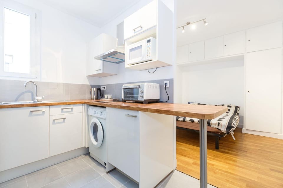 Kitchen or kitchenette, Living room, Dining area, microwave, stove, toaster, washing machine