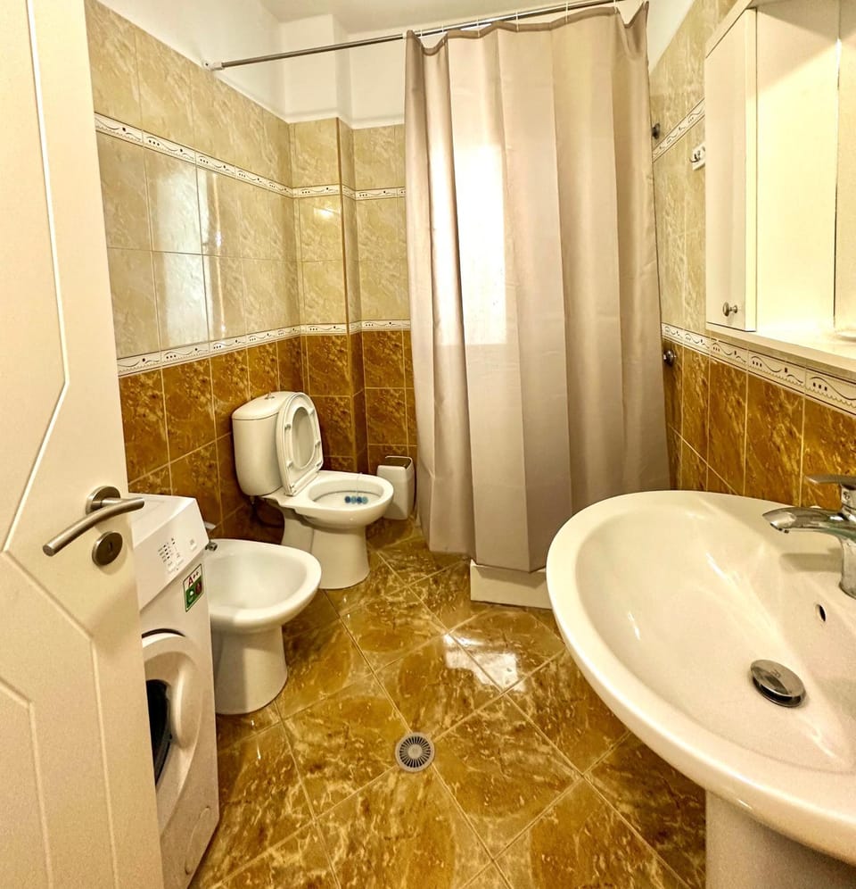 Shower, Toilet, Bathroom, Bath, bidet, towels, washing machine, dryer