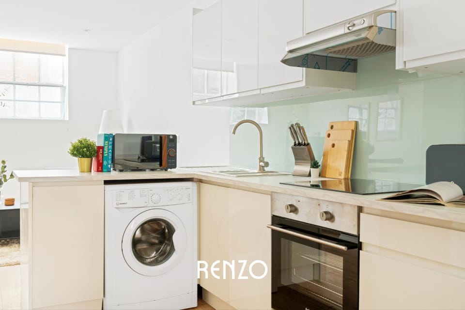Kitchen or kitchenette, oven, stove, toaster, washing machine