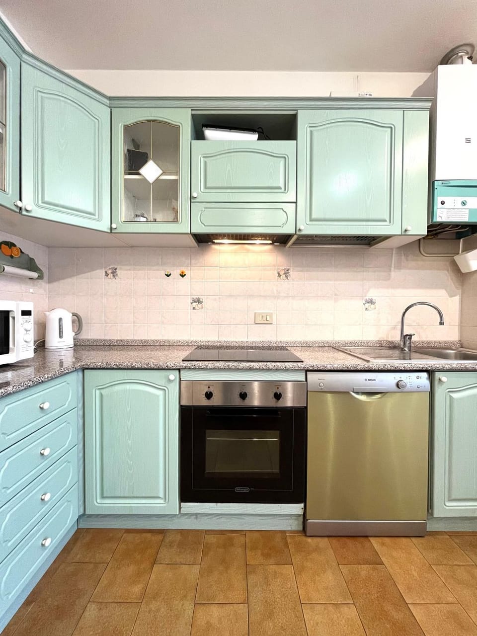 Kitchen or kitchenette, dishwasher, oven, stove