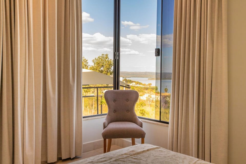 Natural landscape, View (from property/room), Decorative detail, Seating area, Bedroom, Lake view, Pool view