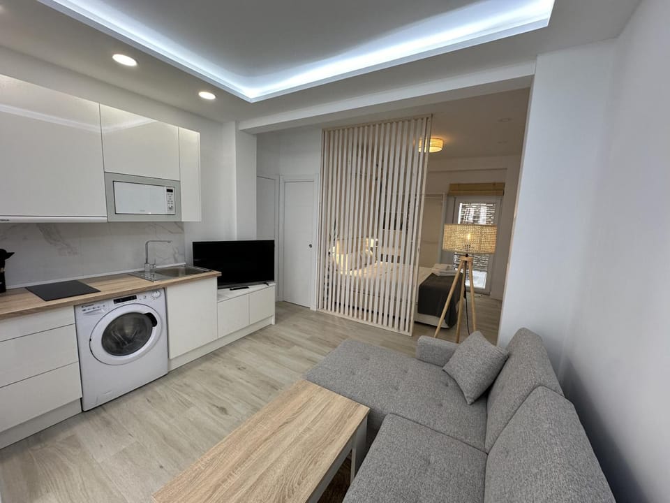 TV and multimedia, Living room, Photo of the whole room, Seating area, washing machine, dryer