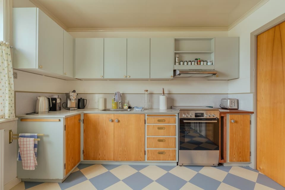 Kitchen or kitchenette, dishwasher, oven, stove, toaster