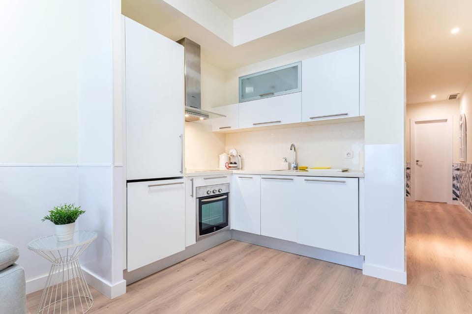 Kitchen or kitchenette, dishwasher, oven, stove