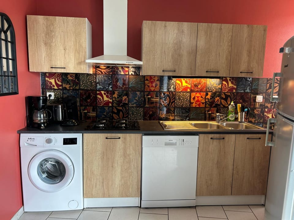 Kitchen or kitchenette, dishwasher, oven, stove, washing machine