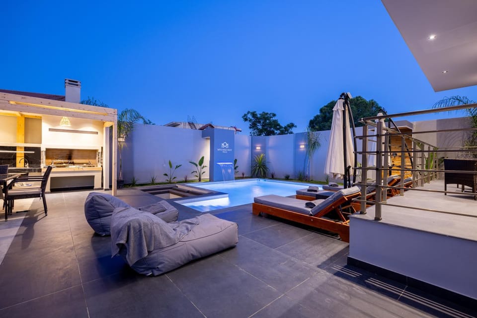 Patio, Night, Seating area, Pool view, Swimming pool, sunbed