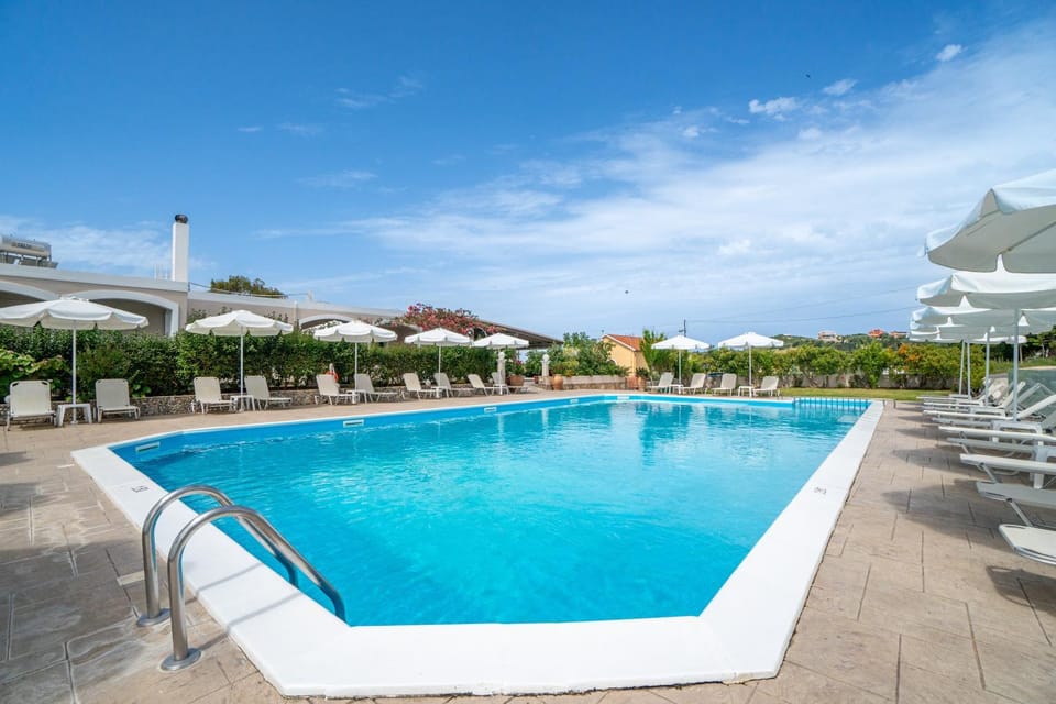 Property building, Living room, Swimming pool