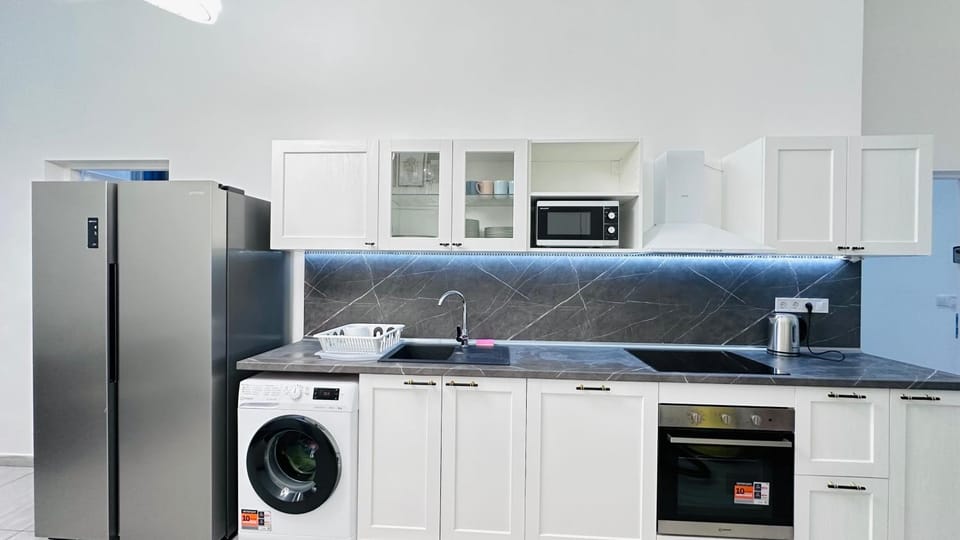 Kitchen or kitchenette, dishwasher, stove, washing machine, dryer