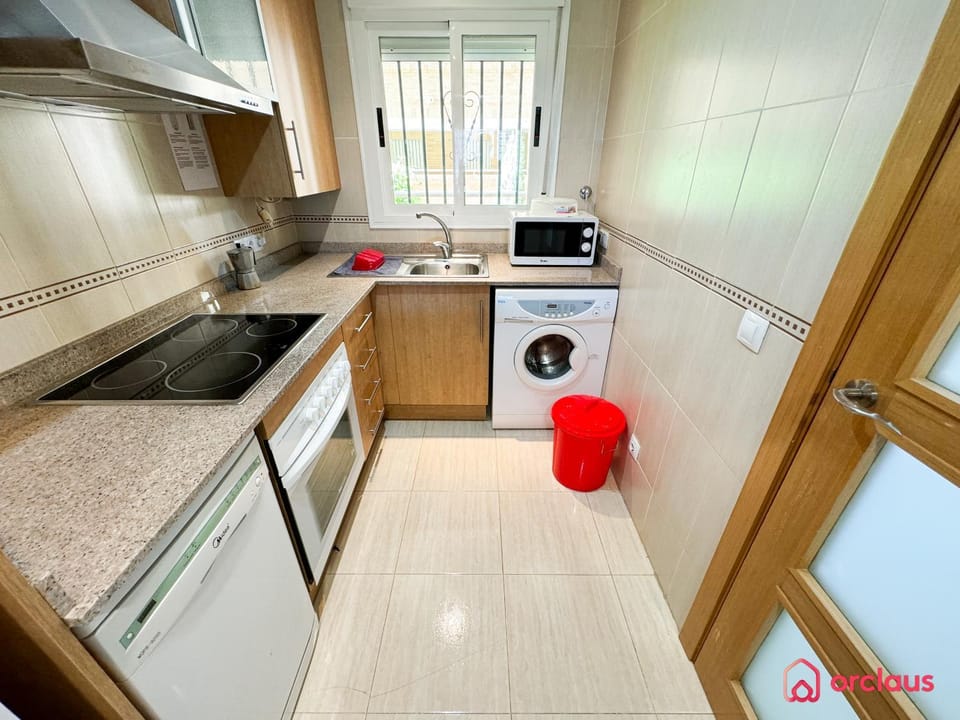 Kitchen or kitchenette, dishwasher, oven, stove, washing machine
