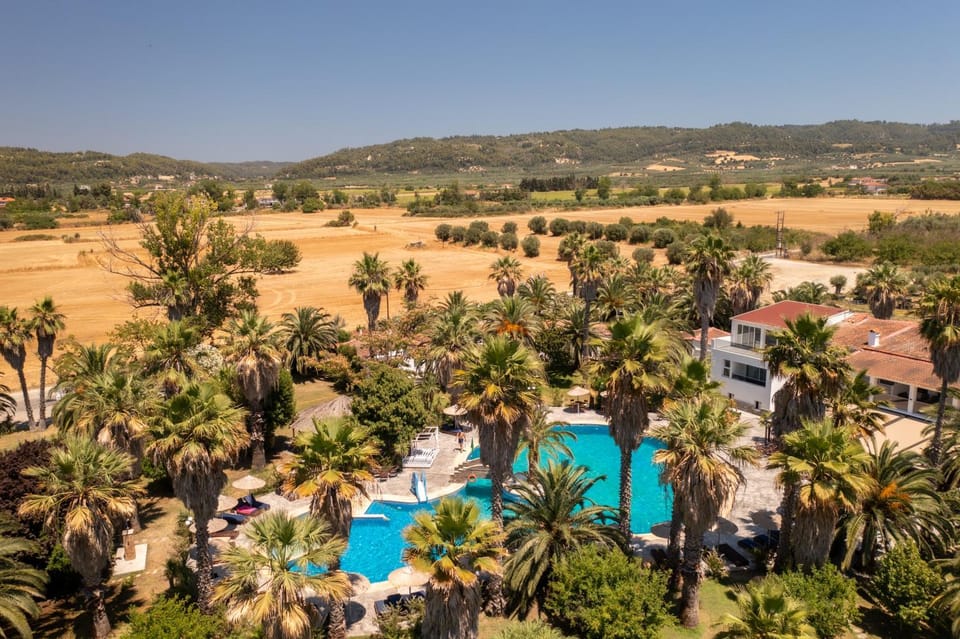 Property building, Nearby landmark, Spring, Day, Natural landscape, Bird's eye view, Mountain view, Pool view, Swimming pool, sunbed