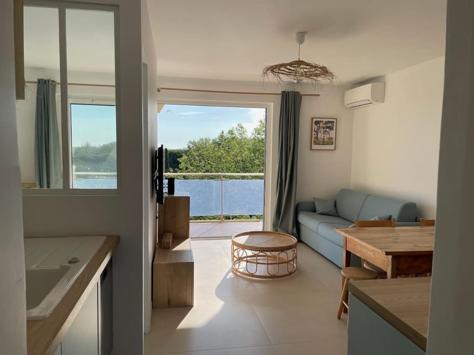 View (from property/room), Living room, Seating area, air conditioner